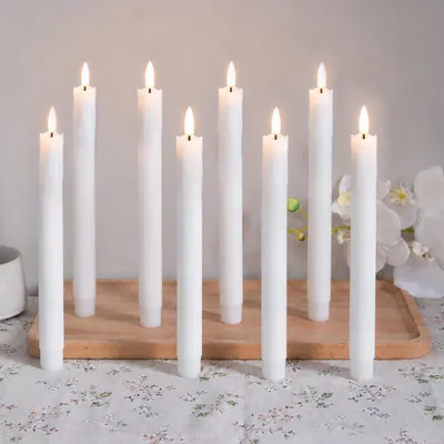 Immagine prodotto di 8 candele a LED a forma di bastoncino, luce bianco caldo, 19 cm, senza fiamma, alimentate a batteria, ideali per decorazioni natalizie, matrimoni, feste e altri eventi, colore bianco