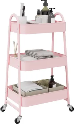 A pink three-tier storage cart with various bathroom or personal care items on its shelves.