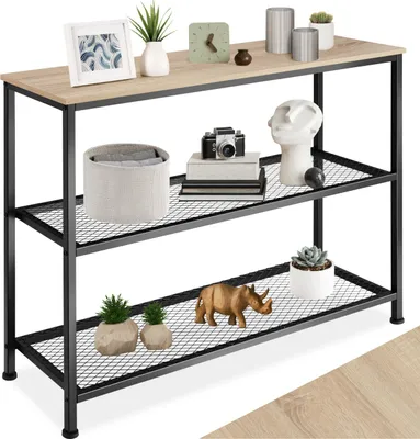 A console table with decorative items on its shelves.