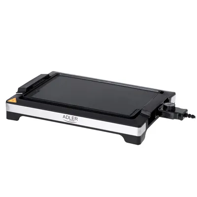 A black and silver table grill is shown from a side angle against a white background.