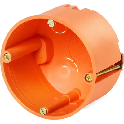An orange electrical junction box with screws.