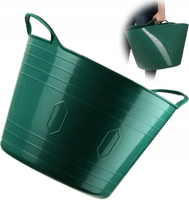 A green flexible plastic basket with handles, shown from a slightly angled perspective. A person's hands are visible in the upper right corner, holding a similar basket.