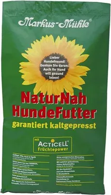 A green bag of dog food with a sunflower and text.