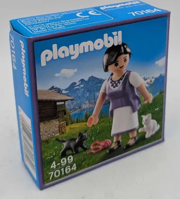 Produktbild von PLAYMOBIL 70164 Sonderfigur Milka Bäuerin mit Kätzchen