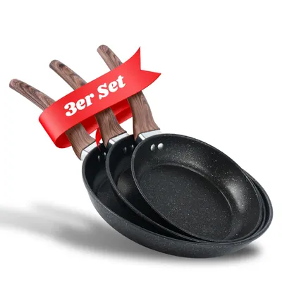 Three frying pans are stacked and angled, with a red ribbon overlaying the handles.