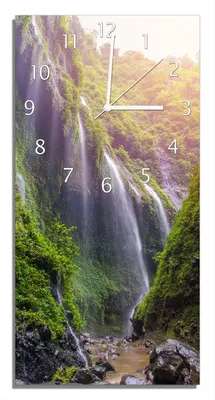 Produktbild von Wallario Design Wanduhr Wasserfall im Morgenlicht aus Echtglas, Größe 30 x 60 cm