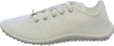 A side view of a white sneaker.