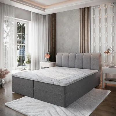 A bedroom scene featuring a large bed.