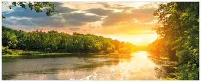 Produktbild von Wallario Premium Glasbild, freischwebende Optik, kräftige Farben, Größe 80 x 32 cm Motiv Sonnenuntergang am Fluss in grüner Umgebung