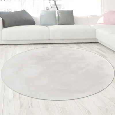 Immagine prodotto di Tappeto in pelliccia di coniglio bianco dall'aspetto elegante e morbido, con un fine luccichio moderno Dimensioni - 160 cm rotondo