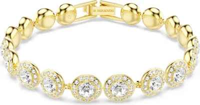 A gold-toned Swarovski tennis bracelet with clear crystals, displayed on a white background.