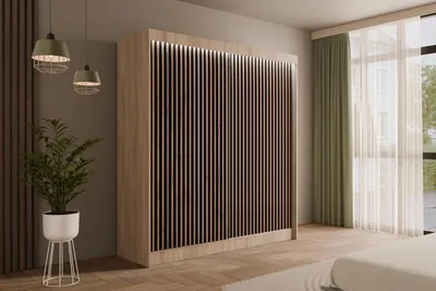 A modern bedroom with a large wardrobe, plant, and window with curtains.