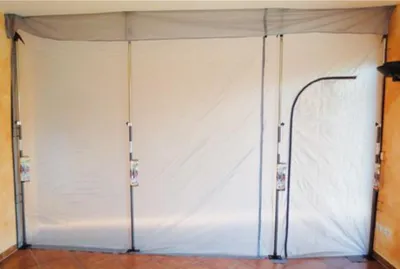 A dust protection wall set up in a room.