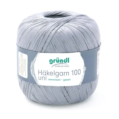 A ball of grey yarn with a label wrapped around it, set against a white background.