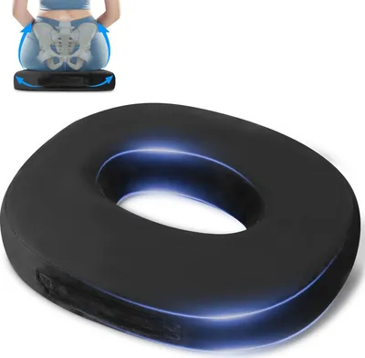 A person sitting on a donut-shaped cushion, with a diagram showing the pelvic bones and arrows indicating support.