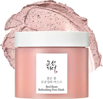 A jar of pink pore mask with a dollop of the mask on top.