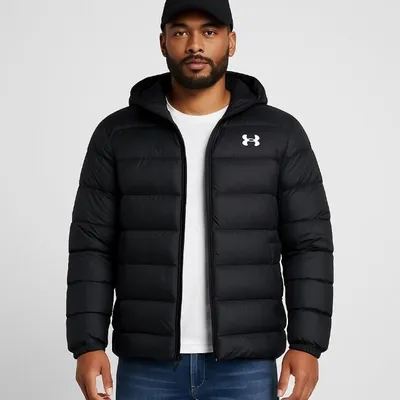 A man wearing a black hooded puffer jacket with the Under Armour logo on the chest.