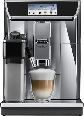 A close-up front view of a DeLonghi PrimaDonna Elite coffee machine, with a latte in a glass in the foreground.