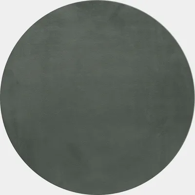 A circular rug with a high pile and a plain gray color.