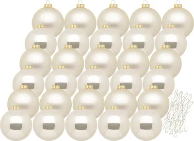 A collection of champagne-colored Christmas ornaments arranged in rows on a white background.
