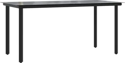 A black metal and glass dining table is shown against a white background.