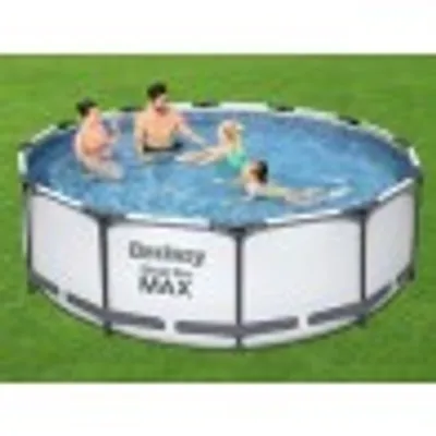 People are enjoying a swim in an above-ground pool set up on a grassy lawn.