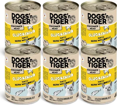 A group of six cans of dog food arranged in two rows of three.