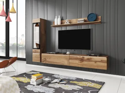 A modern living room with a wall-mounted entertainment unit and TV.
