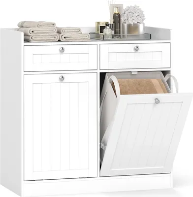 A white bathroom cabinet with a tilt-out laundry hamper and drawers, displayed on a white background.