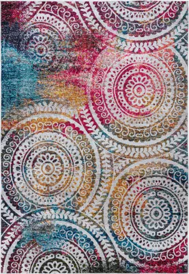 A flat lay image of a rug with a mandala pattern.