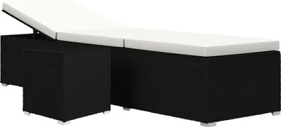 A black poly rattan chaise lounge with a white cushion and a small matching cube stool.