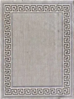 A flat lay of a rectangular rug with a Greek key border.