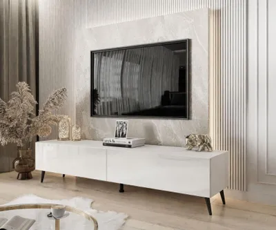 A modern living room with a TV stand and television.