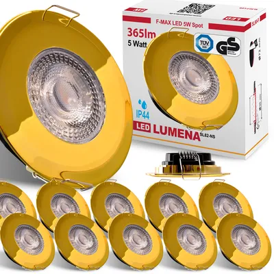 A product shot of multiple gold LED downlights with packaging in the background.