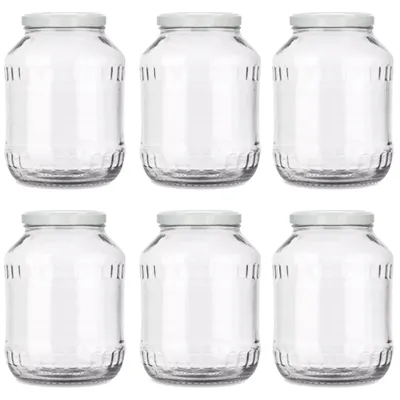 Six clear glass jars with white lids are arranged in two rows of three on a white background.
