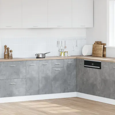 A modern kitchen with concrete-effect cabinets and white upper cabinets.