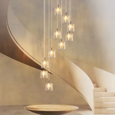 A modern staircase with a series of hanging pendant lights.
