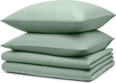 A stack of folded bedding and pillows.