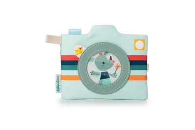 A fabric toy camera with a cartoon rhino inside the lens, set against a white background.
