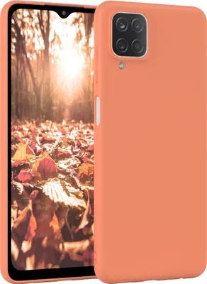 A smartphone with an orange case is shown against a background of autumn leaves.