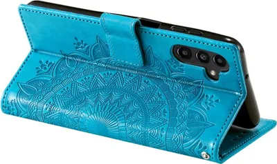 A teal flip case for a smartphone, open to reveal the phone inside. The case has an embossed mandala pattern.