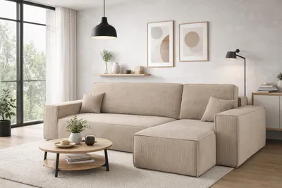A modern living room with a sectional sofa, coffee table, and decor.