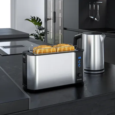 A toaster and kettle are on a kitchen counter.