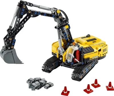 A yellow LEGO Technic hydraulic excavator model is shown on a white background, with some small accessory pieces and traffic cones in the foreground.