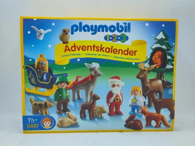 A Playmobil 1.2.3 Advent Calendar box featuring various Christmas-themed figures and animals.