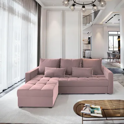 A pink sectional sofa with an ottoman is shown in a well-lit living room.