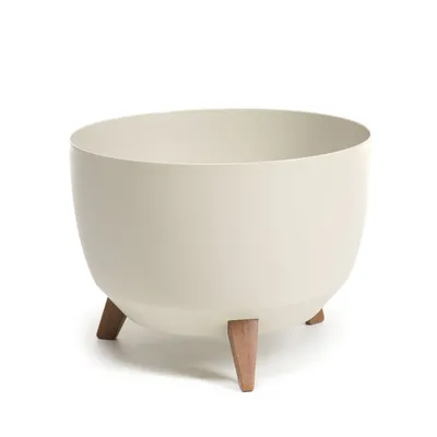 A cream-colored planter pot with three wooden legs, set against a white background.