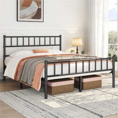 A black metal bed frame with a mattress and bedding is shown in a bedroom setting.