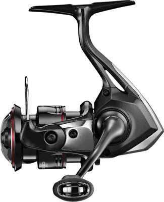 A studio shot of a fishing reel against a white background.
