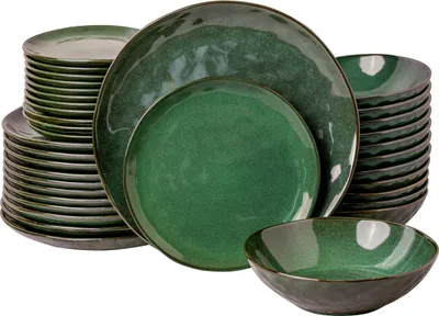 A stack of green ceramic plates and bowls.